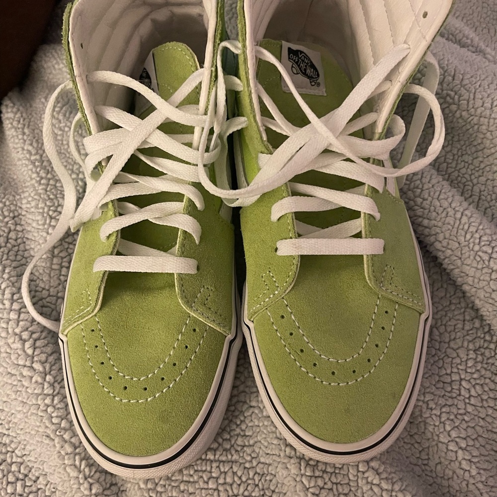 Leather and canvas women’s size 9 Vans high tops. Only worn once or twice.